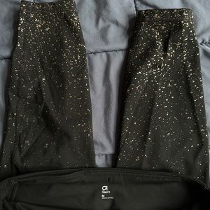 Black Gap Fit leggings with gold embellishments. Size M